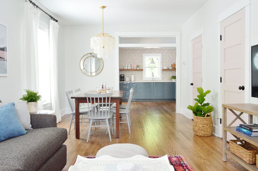 Open Concept Living Room With Pink Doors Extra White Trim