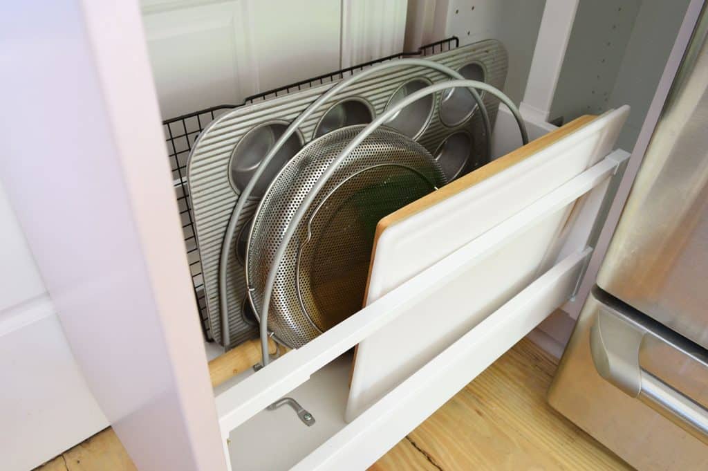 Detail Of Metal Dividers Separating Cutting Boards And Muffin Tins