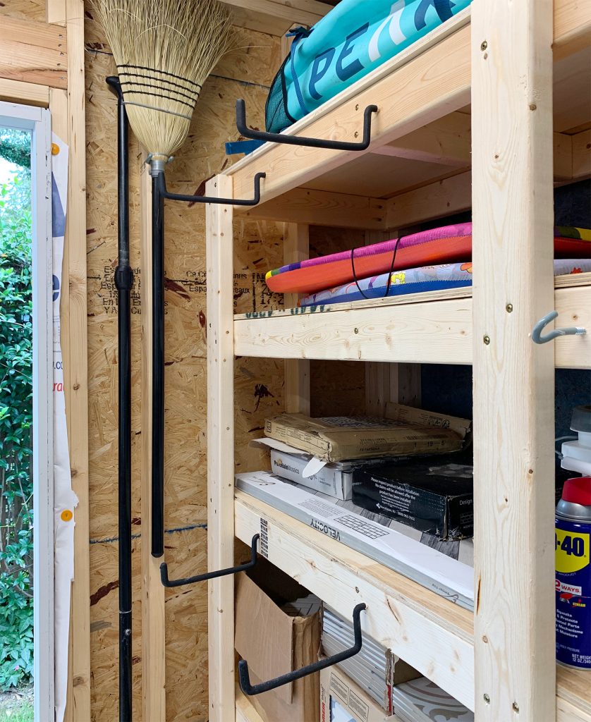 Large rubber hanging hooks on front of heavy duty shed shelves